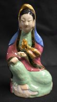 A LATE 19TH CENTURY CHINESE FAMILLE ROSE PORCELAIN FIGURE OF A FEMALE IMMORTAL Qing, modelled with a
