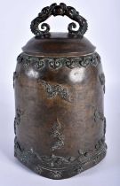 AN 18TH CENTURY JAPANESE EDO PERIOD BRONZE BELL overlaid with clouds and rui motifs, the handles
