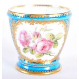 Sevres rare egg cup painted with roses in one panel and a bird in the other, both surrounded by a