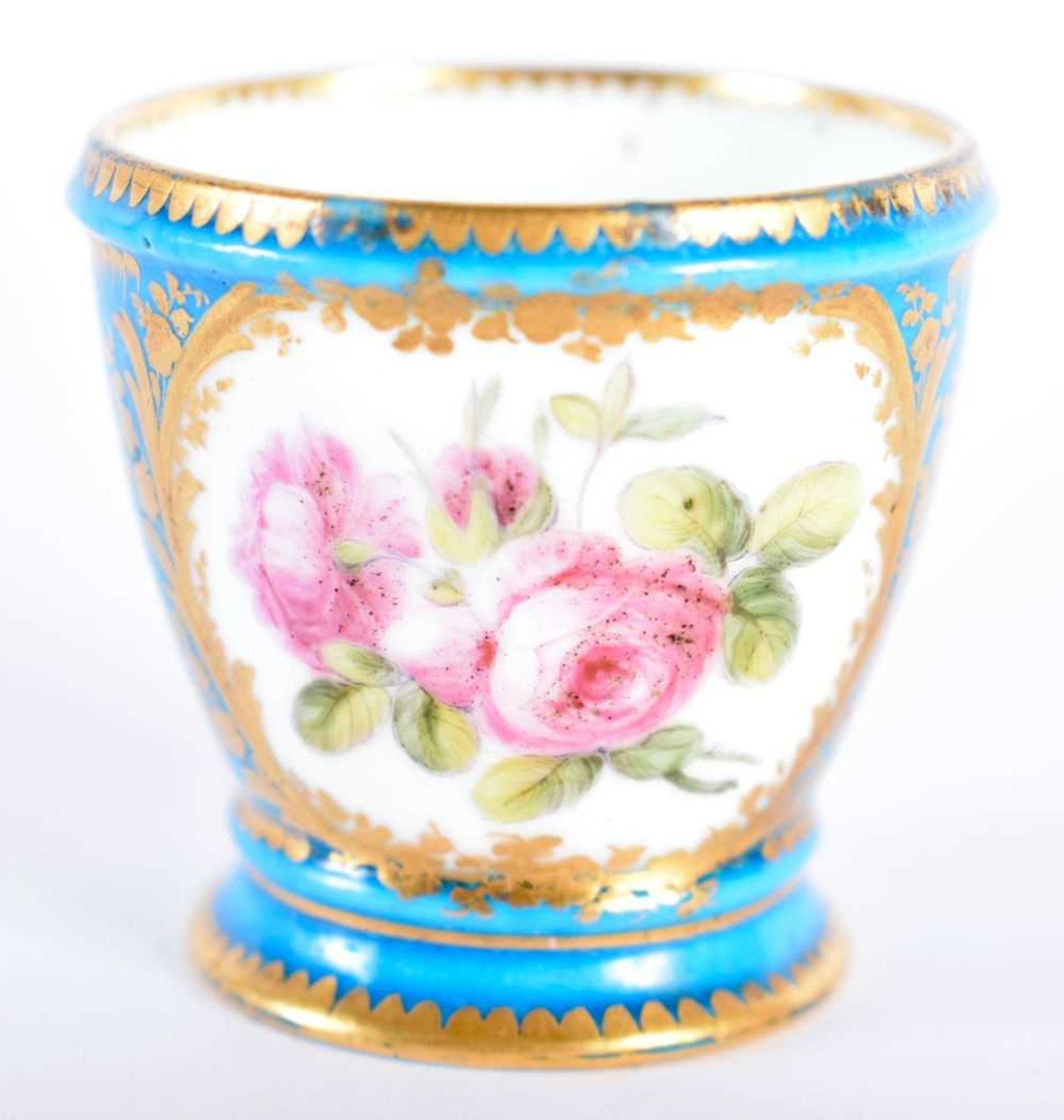 Sevres rare egg cup painted with roses in one panel and a bird in the other, both surrounded by a