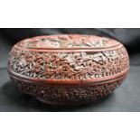 A FINE LARGE 19TH CENTURY CHINESE CARVED CINNABAR LACQUER CIRCULAR BOX AND COVER decorated all