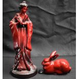 A ROYAL DOULTON FLAMBE GEISHA together with a similar rabbit. Largest 23.5 cm high. (2)