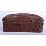 A CHINESE QING DYNASTY CARVED CINNABAR LACQUER DRAGON BOX AND COVER formed with a dragon amongst