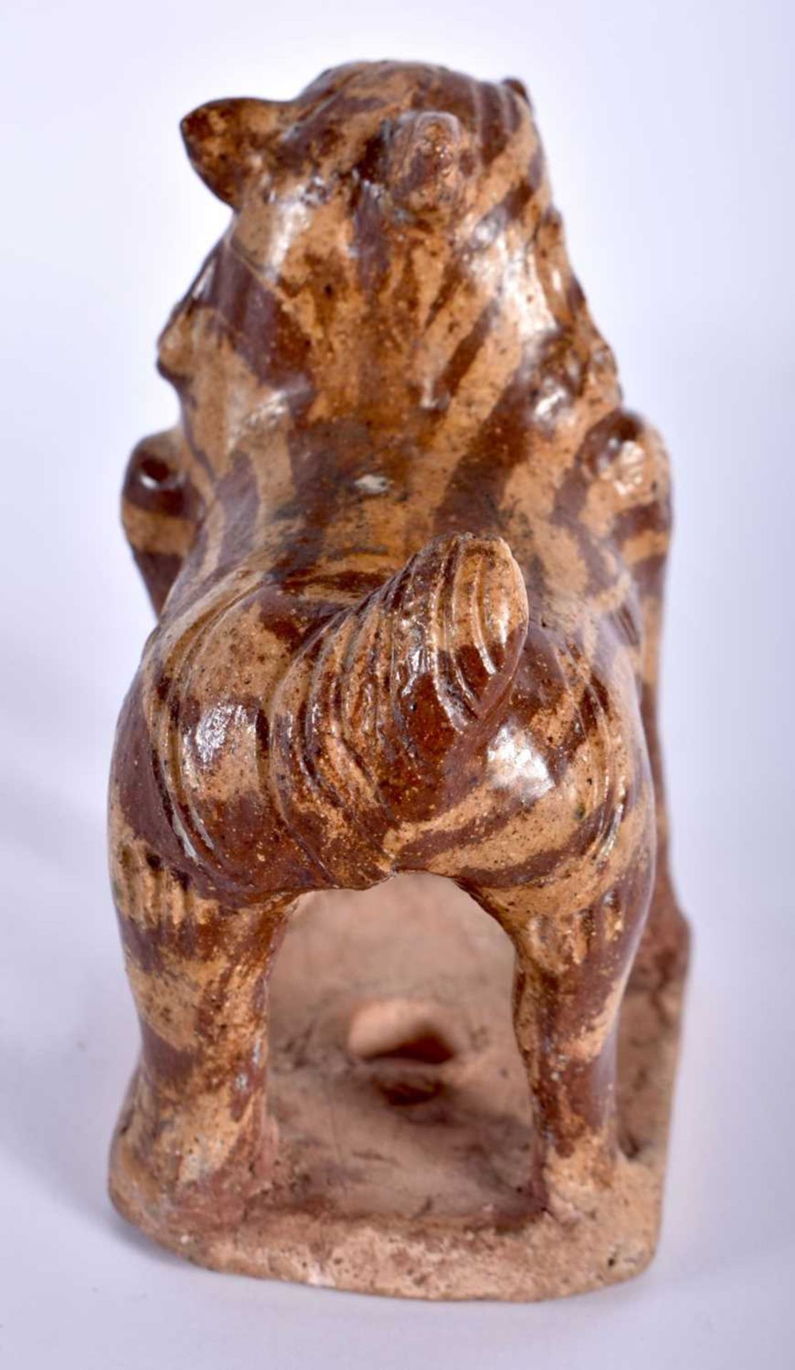 AN EARLY CHINESE MARBLEISED POTTERY BEAST modelled standing upon an unglazed base. 11 cm x 8 cm. - Image 4 of 5