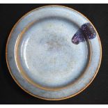 A CHINESE JUNYAO PURPLE-SPLASHED STONEWARE DISH probably Song/Yuan dynasty, with shallow rounded
