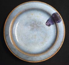 A CHINESE JUNYAO PURPLE-SPLASHED STONEWARE DISH probably Song/Yuan dynasty, with shallow rounded