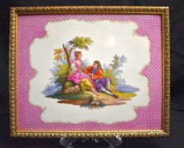 A LARGE 19TH CENTURY KPM PORCELAIN PLAQUE of unusual form, painted with two lovers encased within