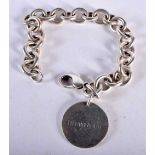 A silver bracelet by Tiffany and Co. Stamped Please Return to Tiffany & Co New York 925, Length 19.