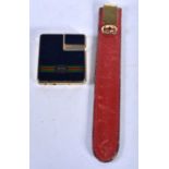 A Vintage Gucci Lighter together with a Gucci Bookmark. Lighter 4.2cm x 4.8cm, Bookmark 15cm long (