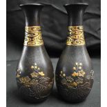 A FINE PAIR OF 19TH CENTURY JAPANESE MEIJI PERIOD GOLD ONLAID IRON VASES decorated in relief with