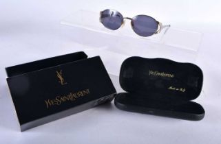 A Boxed and Cased Pair of Yves Saint Laurent Ladies Sunglasses. 13cm wide