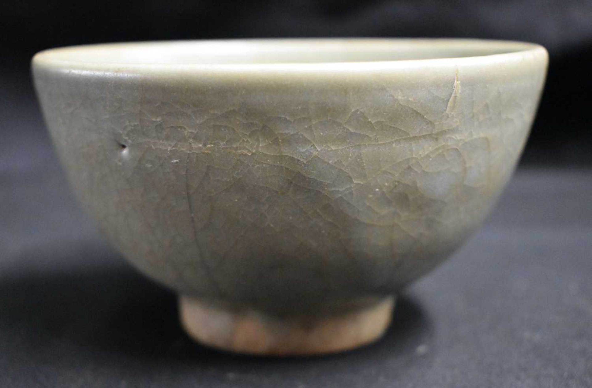 AN EARLY CHINESE CELADON LONGQUAN STONEWARE BOWL Yuan/Ming, of plain elegant form. 12 cm x 8 cm.