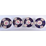 A SET OF FOUR FINE ROYAL CROWN DERBY PORCELAIN PLATES painted with bold sprays under a rich blue and