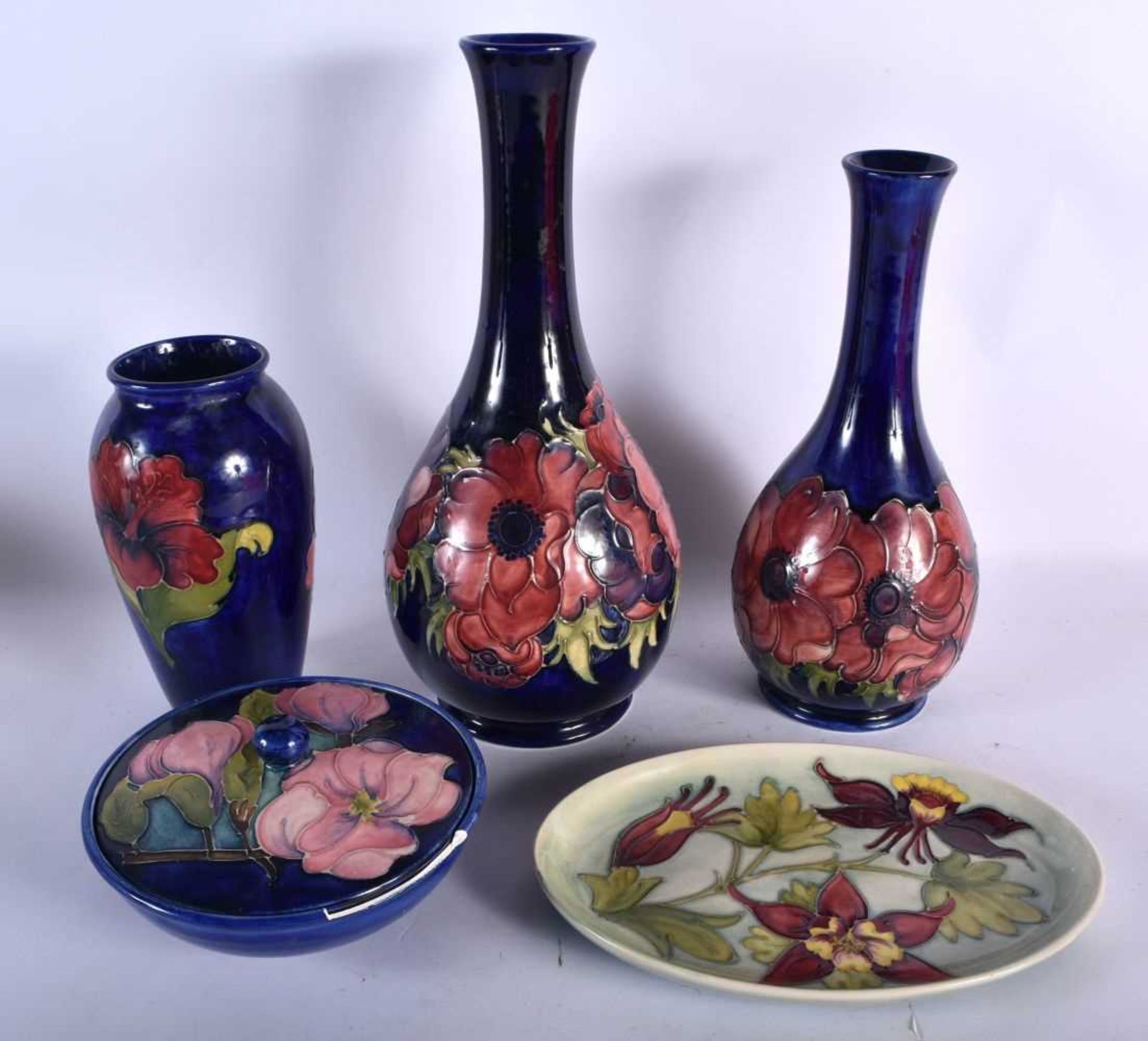 THREE LARGE MOORCROFT VASES together with a bowl & cover & dish. Largest 32 cm high. (5)