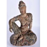 AN EARLY CHINESE POLYCHROMED WOOD FIGURE OF A SEATED BUDDHA Yuan/Ming, elegantly modelled resting