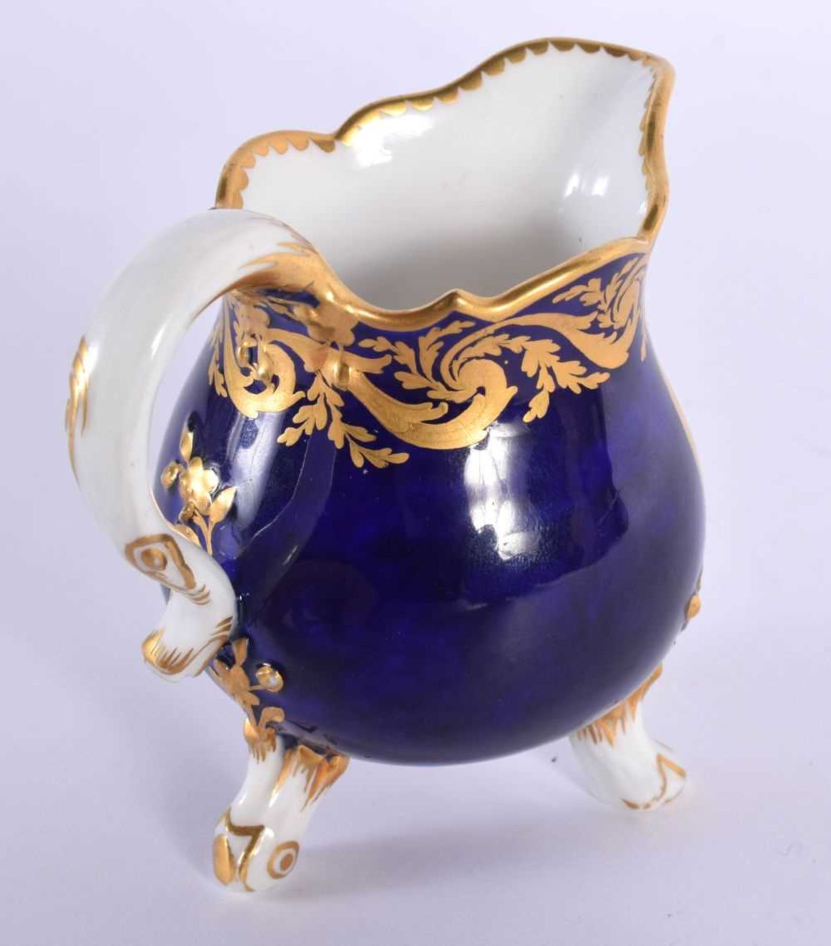 Sevres cream jug on three feet painted with flowers in a tear-drop panel, the cobalt blue ground - Image 2 of 4