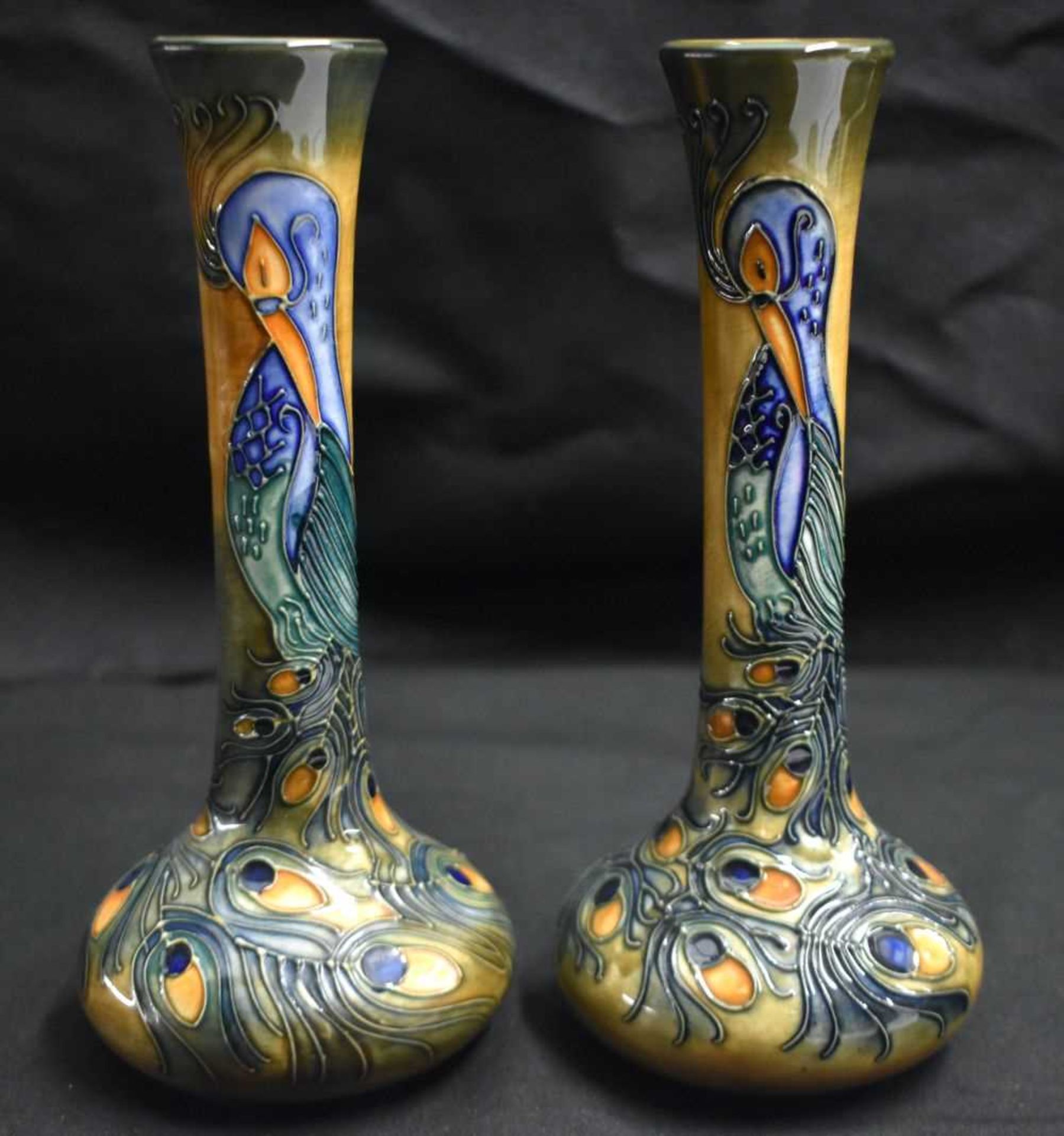 A PAIR OF MOORCROFT PEACOCK FEATHER VASES by Rachel Bishop. 20.5 cm high.