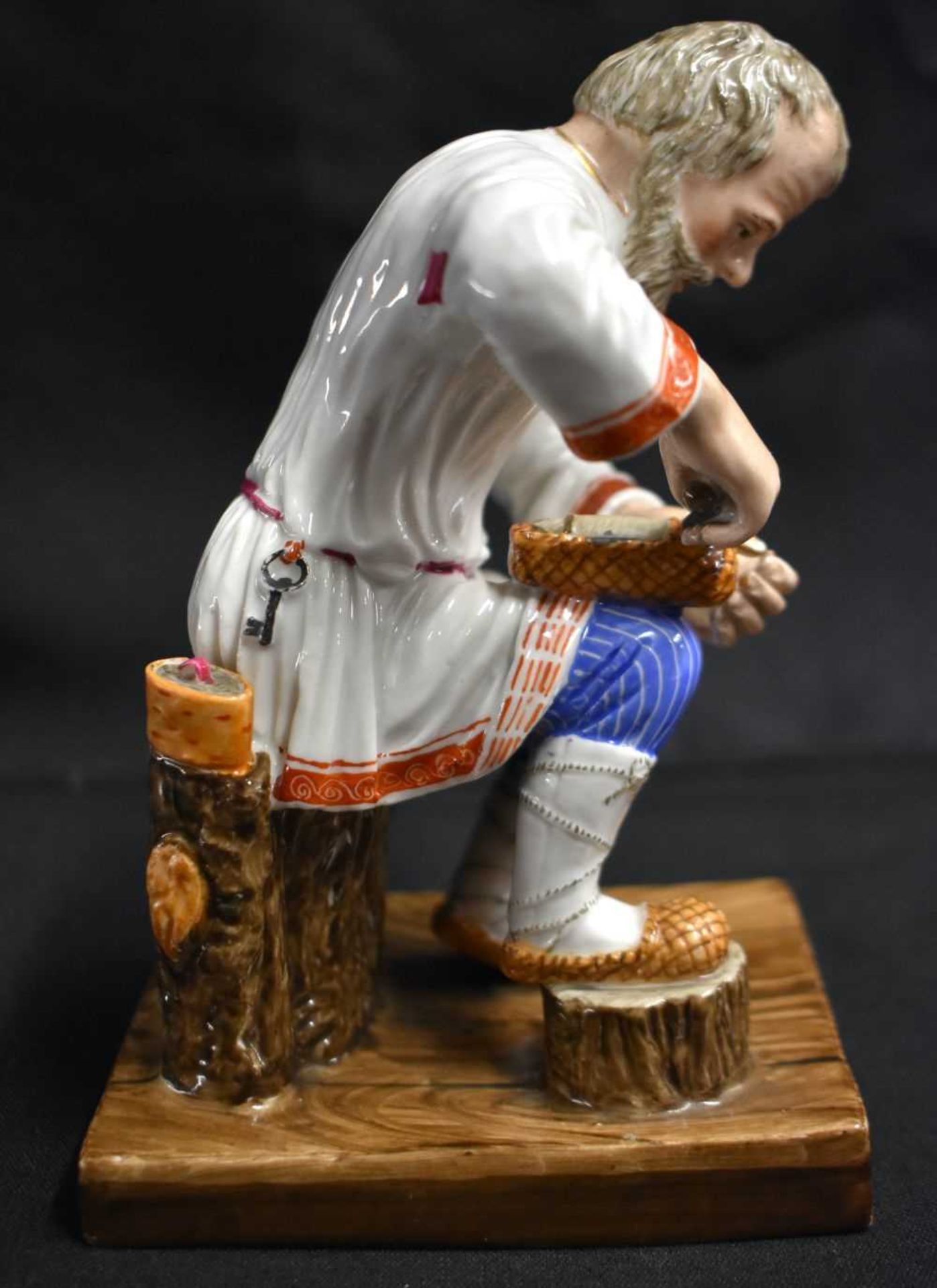 A LATE 19TH CENTURY RUSSIA ST PETERSBURG PORCELAIN FIGURE OF A COBBLER modelled repairing a shoe. 14 - Image 4 of 7