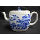 A GOOD 17TH CENTURY CHINESE BLUE AND WHITE PORCELAIN TEAPOT AND COVER Kangxi, of barrel form,