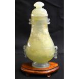 A LATE 19TH CENTURY CHINESE TWIN HANDLED JADE VASE AND COVER Late Qing, with Mughal style finial and