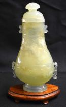 A LATE 19TH CENTURY CHINESE TWIN HANDLED JADE VASE AND COVER Late Qing, with Mughal style finial and
