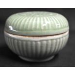 A CHINESE QING DYNASTY CELADON RIBBED BOX AND COVER Yuan/Ming style, of chrysanthemum moulded