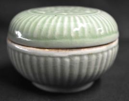 A CHINESE QING DYNASTY CELADON RIBBED BOX AND COVER Yuan/Ming style, of chrysanthemum moulded