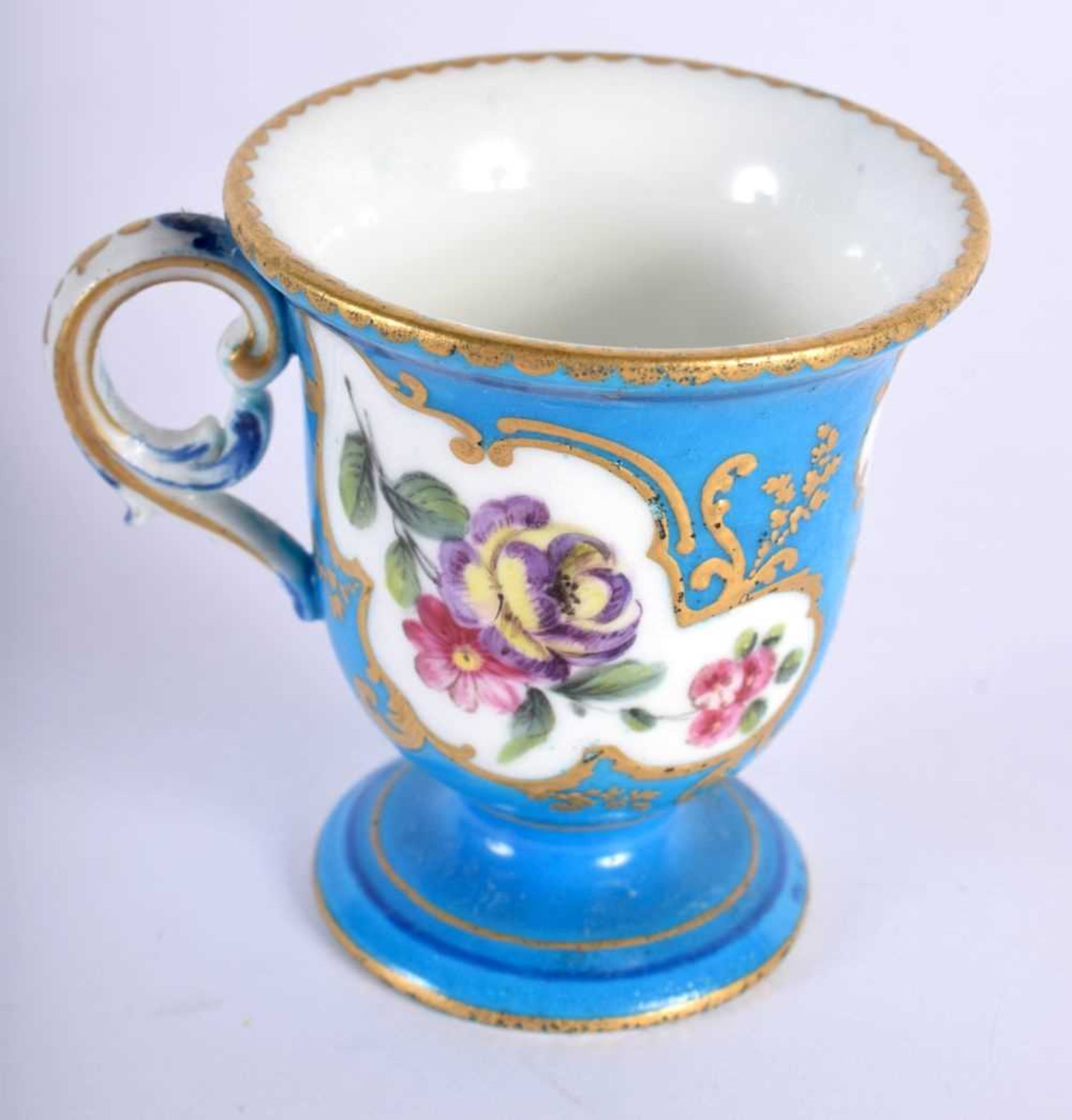 Sevres ice cup with three gilt panels painted with flowers, blue L’s mark. 6.5x6cm.