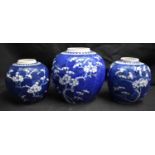 THREE 19TH CENTURY CHINESE BLUE AND WHITE PORCELAIN GINGER JARS Kangxi style. Largest 18 cm x 12 cm.