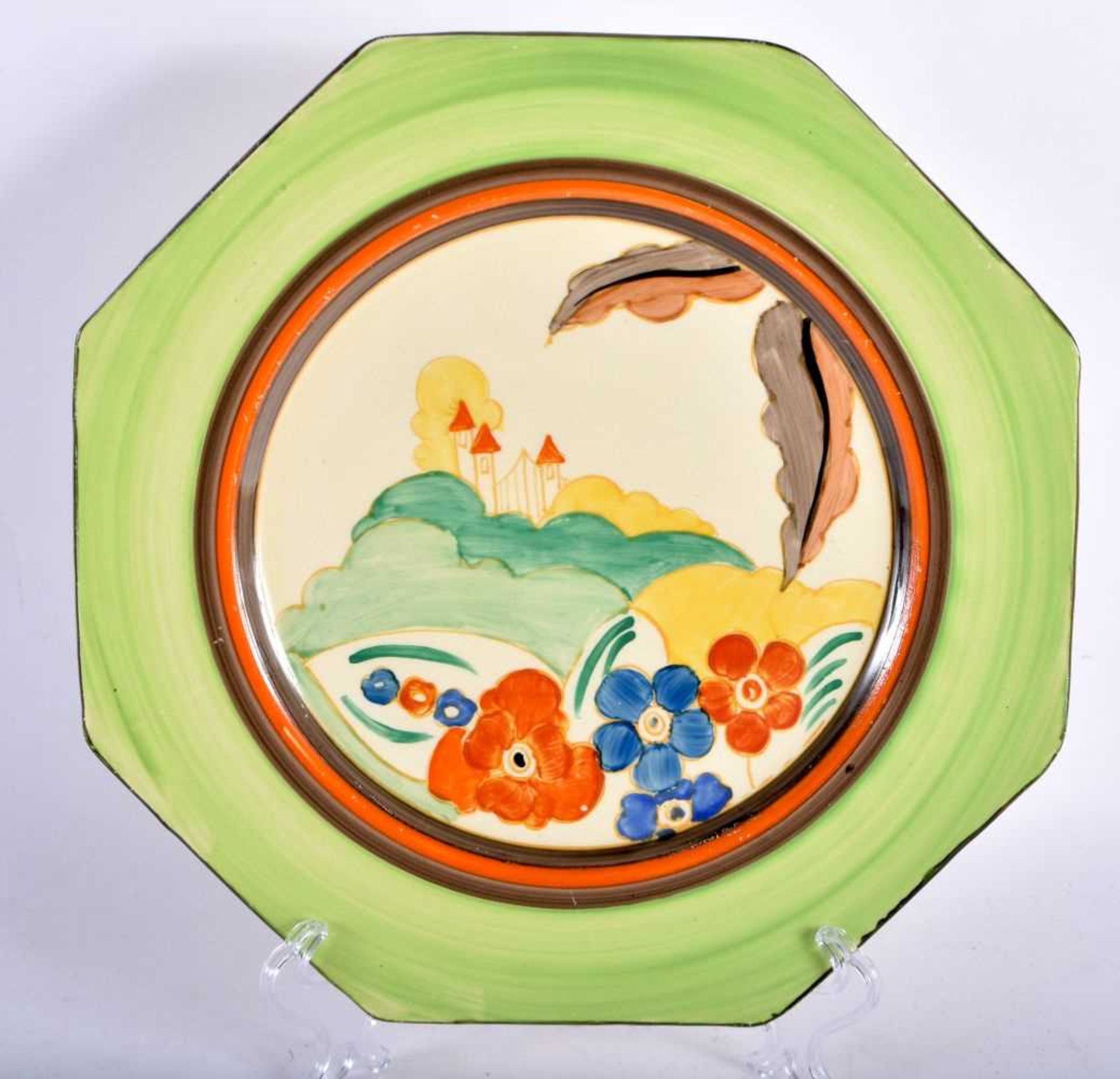 AN ART DECO CLARICE CLIFF FANTASQUE BIZARRE POTTERY PLATE. 23.5 cm wide.