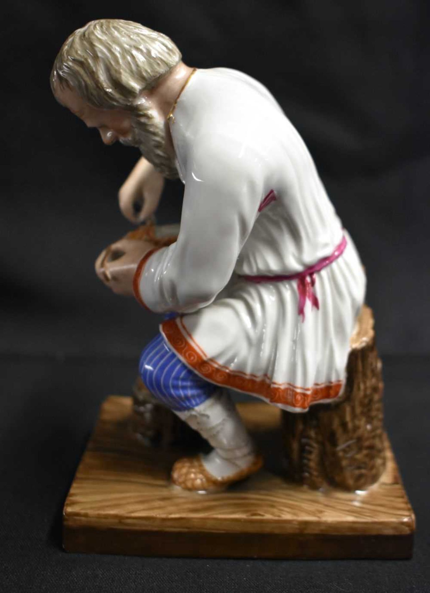 A LATE 19TH CENTURY RUSSIA ST PETERSBURG PORCELAIN FIGURE OF A COBBLER modelled repairing a shoe. 14 - Image 6 of 7
