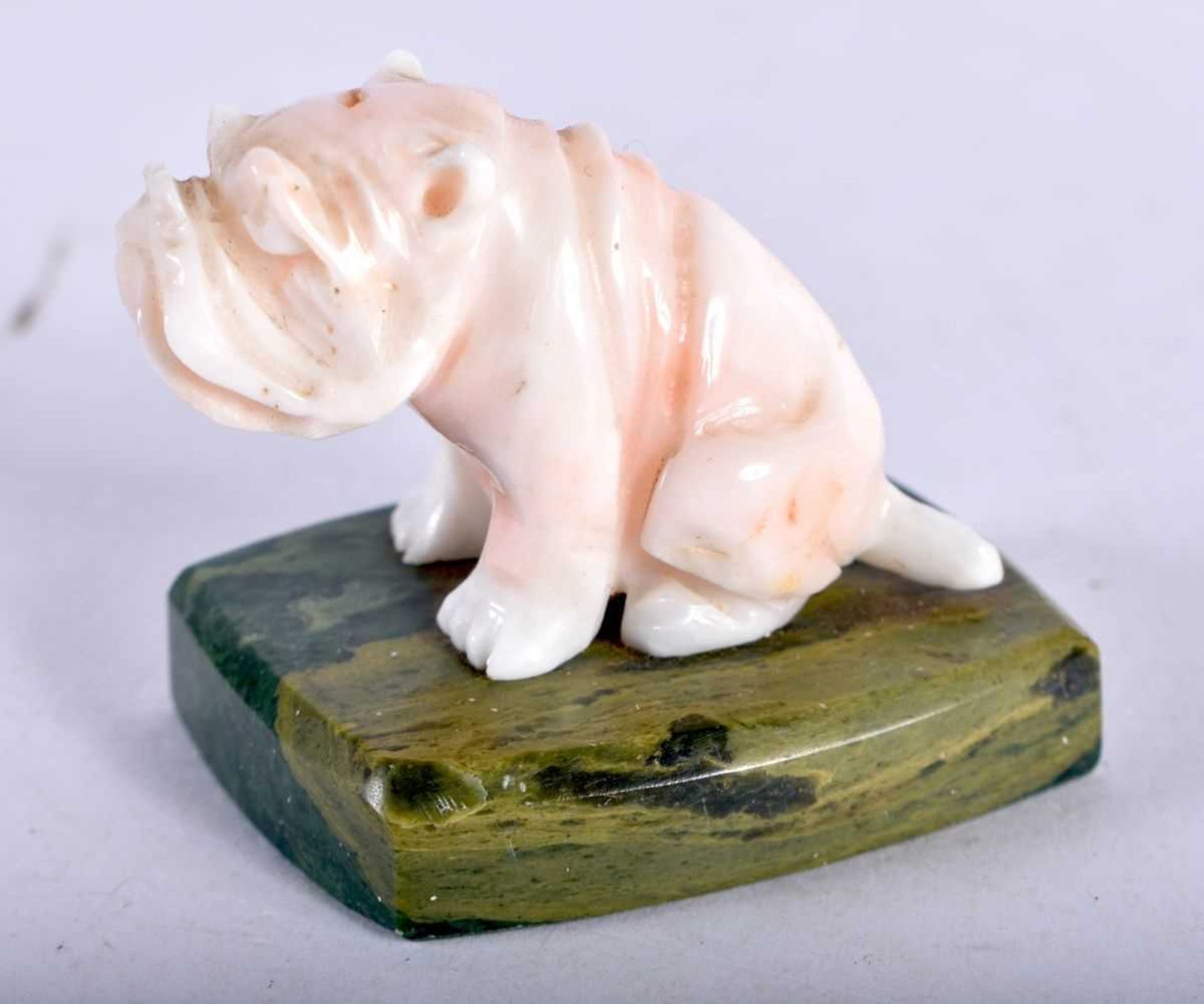 AN ART DECO CARVED PALE RED CORAL FIGURE OF A BULLDOG. 4.5 cm x 4 cm. - Image 2 of 3