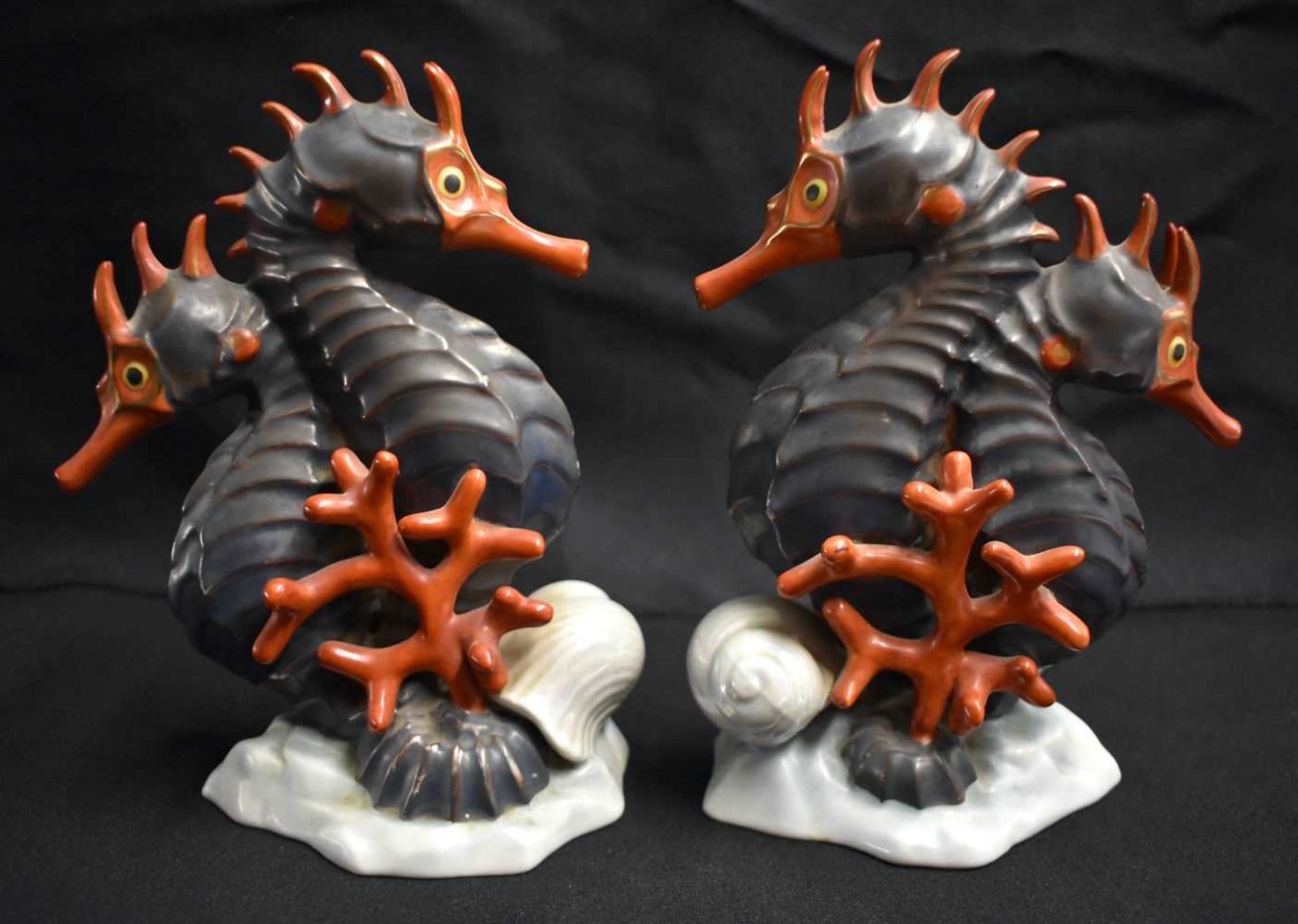 A PAIR OF HEREND HUNGARIAN PORCELAIN SEA HORSES. 18 cm x 9 cm.