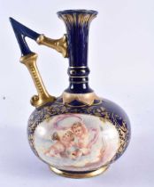 A RARE HUNGARIAN FISCHER BUDAPEST PORCELAIN JUG painted with putti. 19 cm x 12 cm.