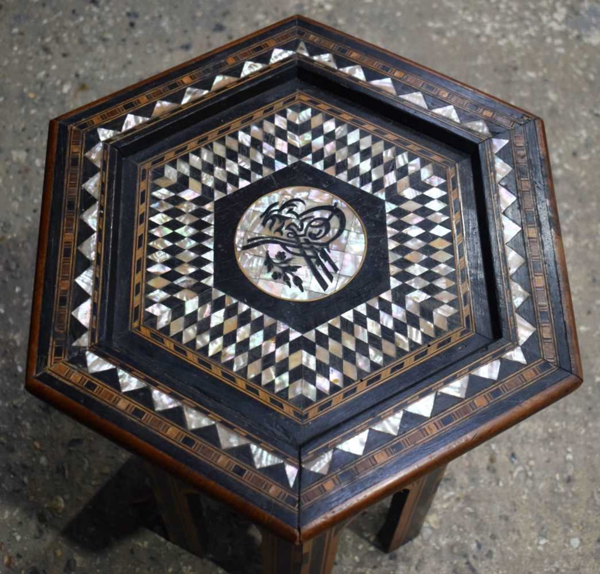 An Islamic wooden hexagonal sided table with Mother of Pearl and wooden inlay 51 x 43cm. - Image 2 of 3