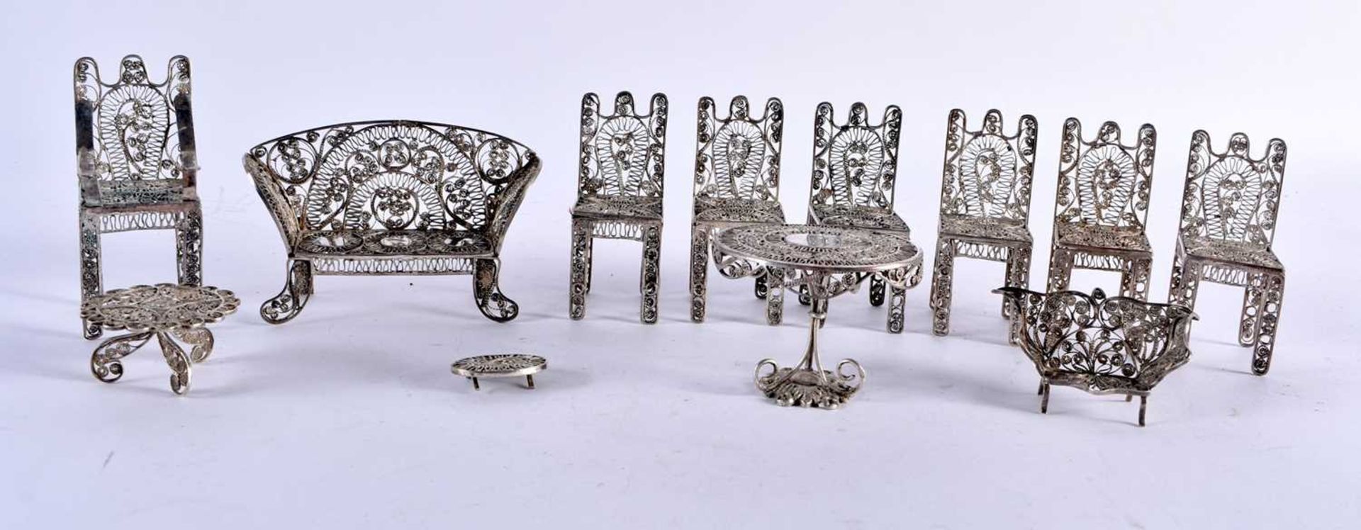 Twelve Pieces of Silver Filigree Dollhouse Miniature Furniture. Largest 9.8cm x 6.5cm x 3.5cm. 239