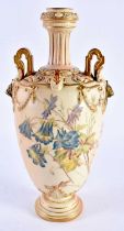 Royal Worcester large vase with lion head handles, painted with flowers in the manner of Edward