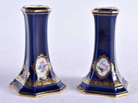 A PAIR OF 19TH CENTURY MEISSEN PORCELAIN FLARED VASES painted with flowers. 10 cm high.