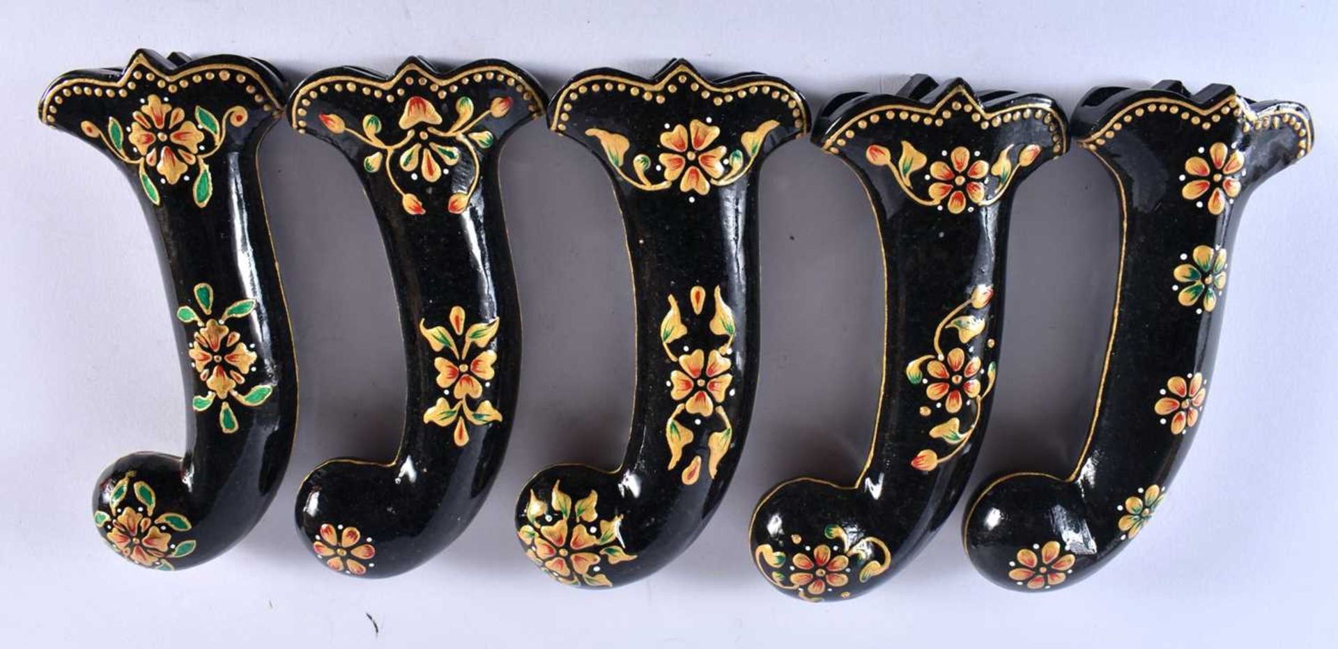 A SET OF FIVE MIDDLE EASTERN QAJAR LACQUER HARDSTONE DAGGER HANDLES overlaid with foliage and vines. - Image 5 of 6