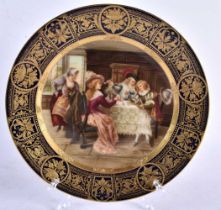 AN ANTIQUE AUSTRIAN VIENNA PORCELAIN CABINET PLATE painted with figures within an interior. 23 cm