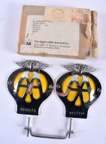 Two Unused AA Car Badges with original packaging and mounting bracket. 11cm x 9.5cm