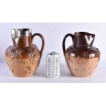 TWO 19TH CENTURY ENGLISH STONEWARE JUGS one with probably silver mounts. Largest 24 cm x 15 cm. (2)