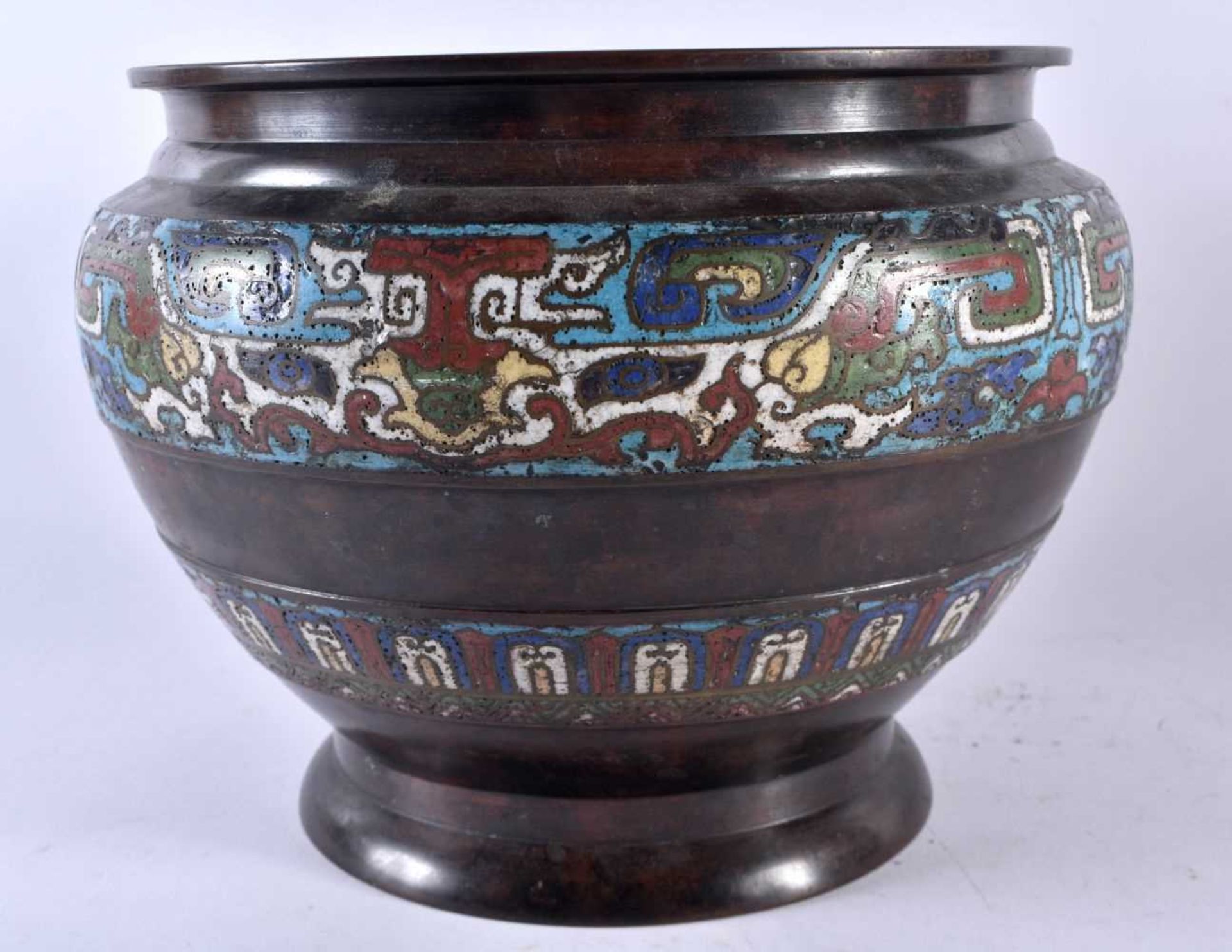 A LARGE 19TH CENTURY JAPANESE MEIJI PERIOD CHAMPLEVE ENAMEL CENSER decorated with archaic motifs. 21