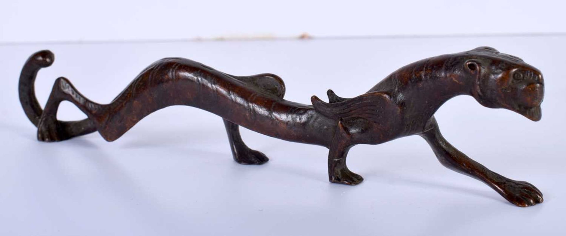 A Japanese Bronze Scroll Weight in the form of a Prowling Tiger 18cm x 4cm x 1.5cm, Weight 166.8g