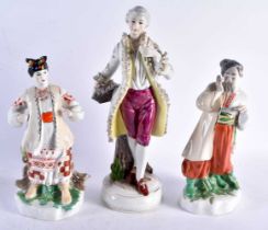 A PAIR OF RUSSIAN UKRANIAN PORCELAIN FIGURES together with another. Largest 33 cm high. (3)