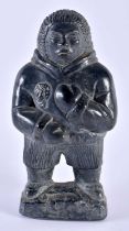 AN INUIT NORTH AMERICAN FIGURE OF AN ESKIMO. 21 cm high.