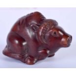 A Carved Hardwood Netsuke of an Ox. 4cm x 6cm x 3.4cm. Weight 29g