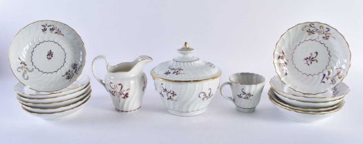 A PART LATE 18TH/19TH CENTURY BARR WORCESTER PORCELAIN TEASET painted with puce and gilt foliage.