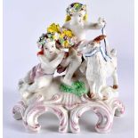 18th century Plymouth group of two semi-clad children and a goat on a rococo scroll base, one