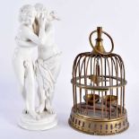 A ITALIAN NAPLES PORCELAIN FIGURE OF A COUPLE EMBRACING, together with a small brass birdcage.